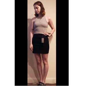 Black cotton miniskirt.